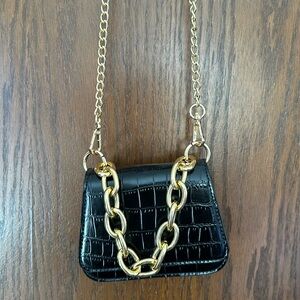 Cute black with gold chain accent purse bag